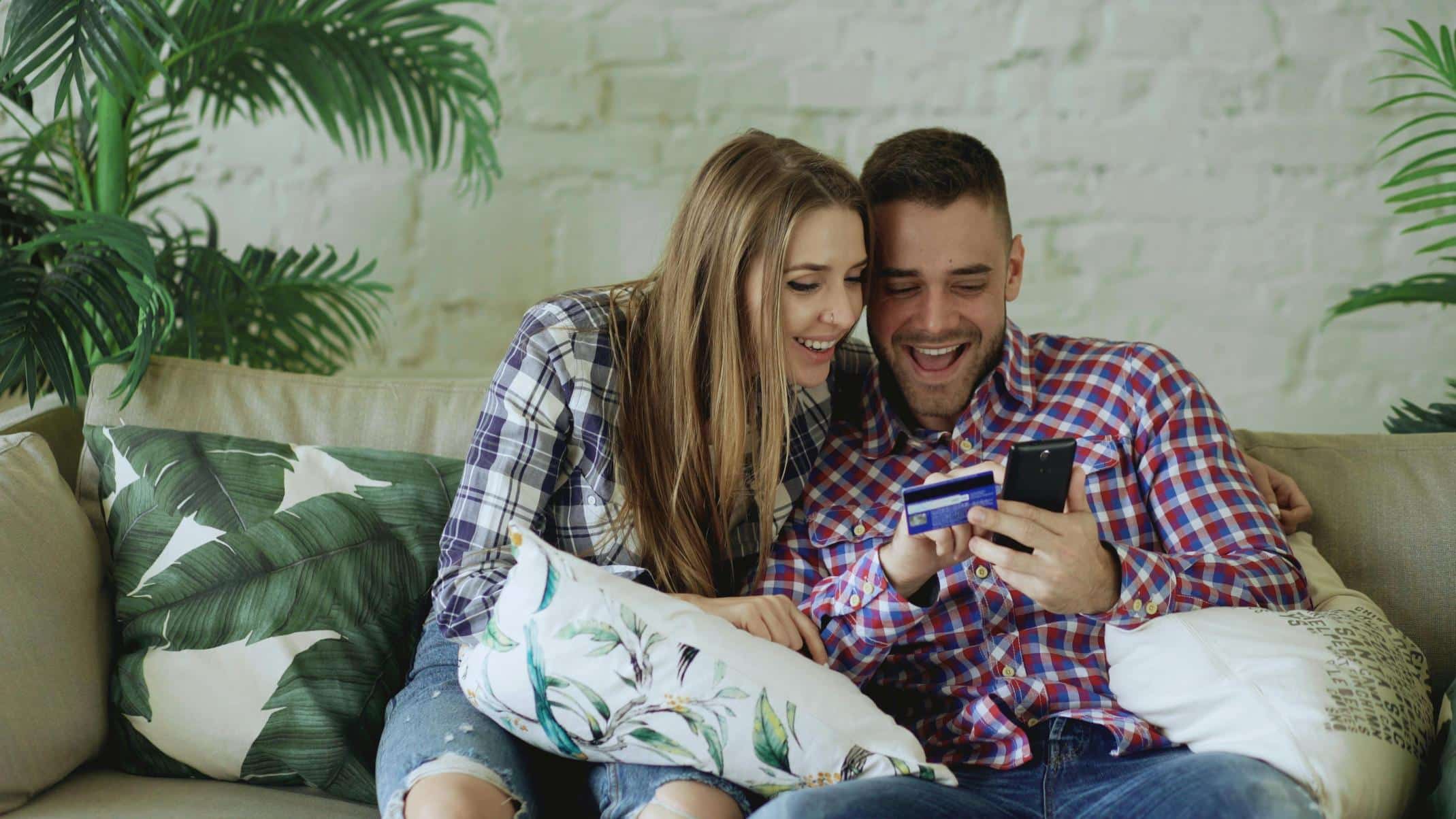 Couple reviewing finances online for FHA Streamline Refinance in Texas to lower mortgage payments and save money.