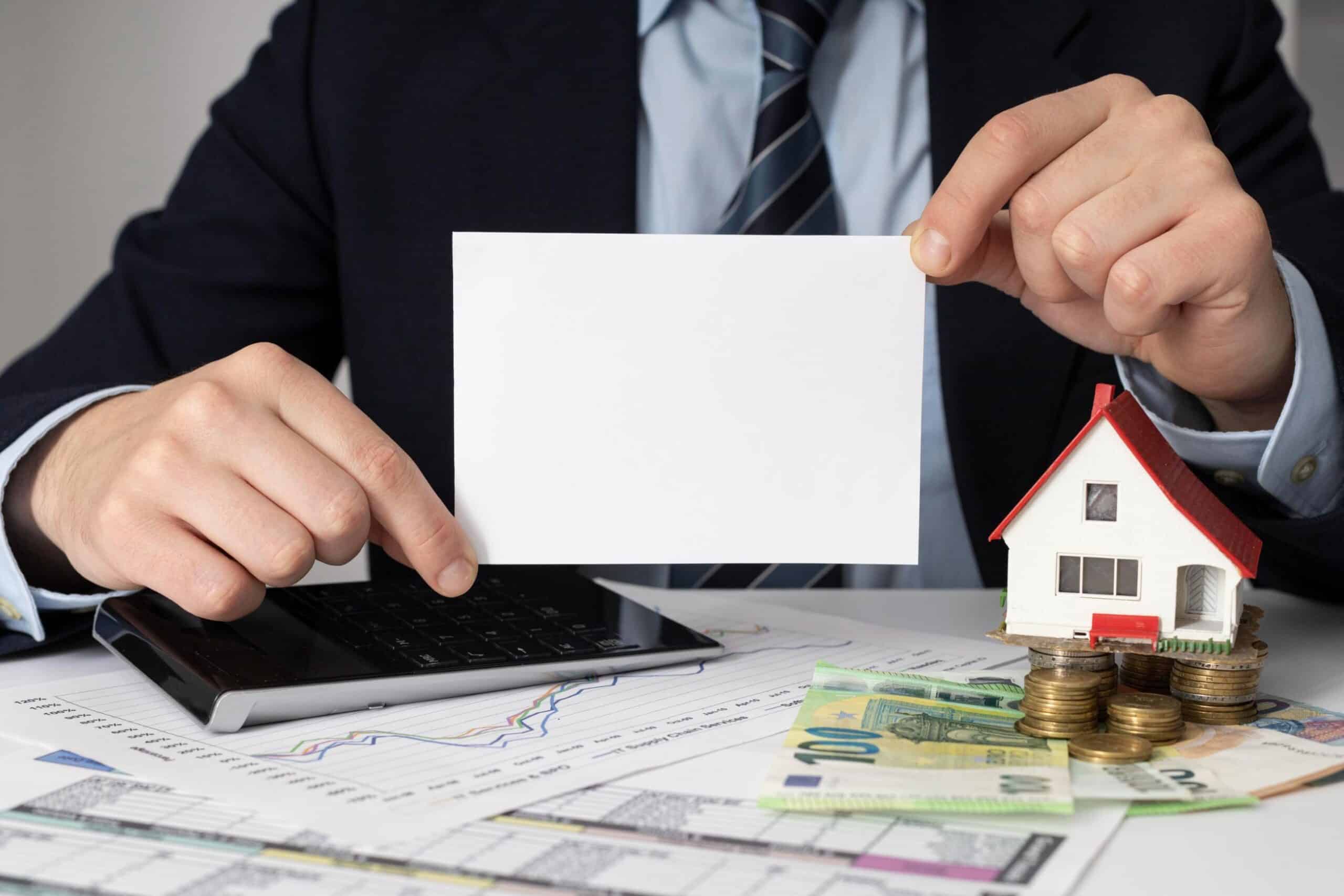 Financial planning for a Texas FHA loan showing documents, calculator, and house model representing home financing process.