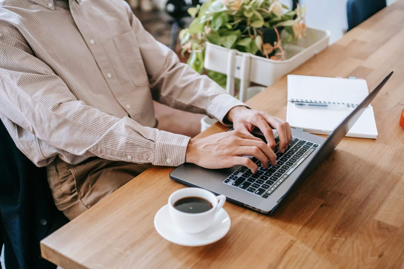 Self-employed professional working on a laptop, representing flexible loan programs for self-employed borrowers