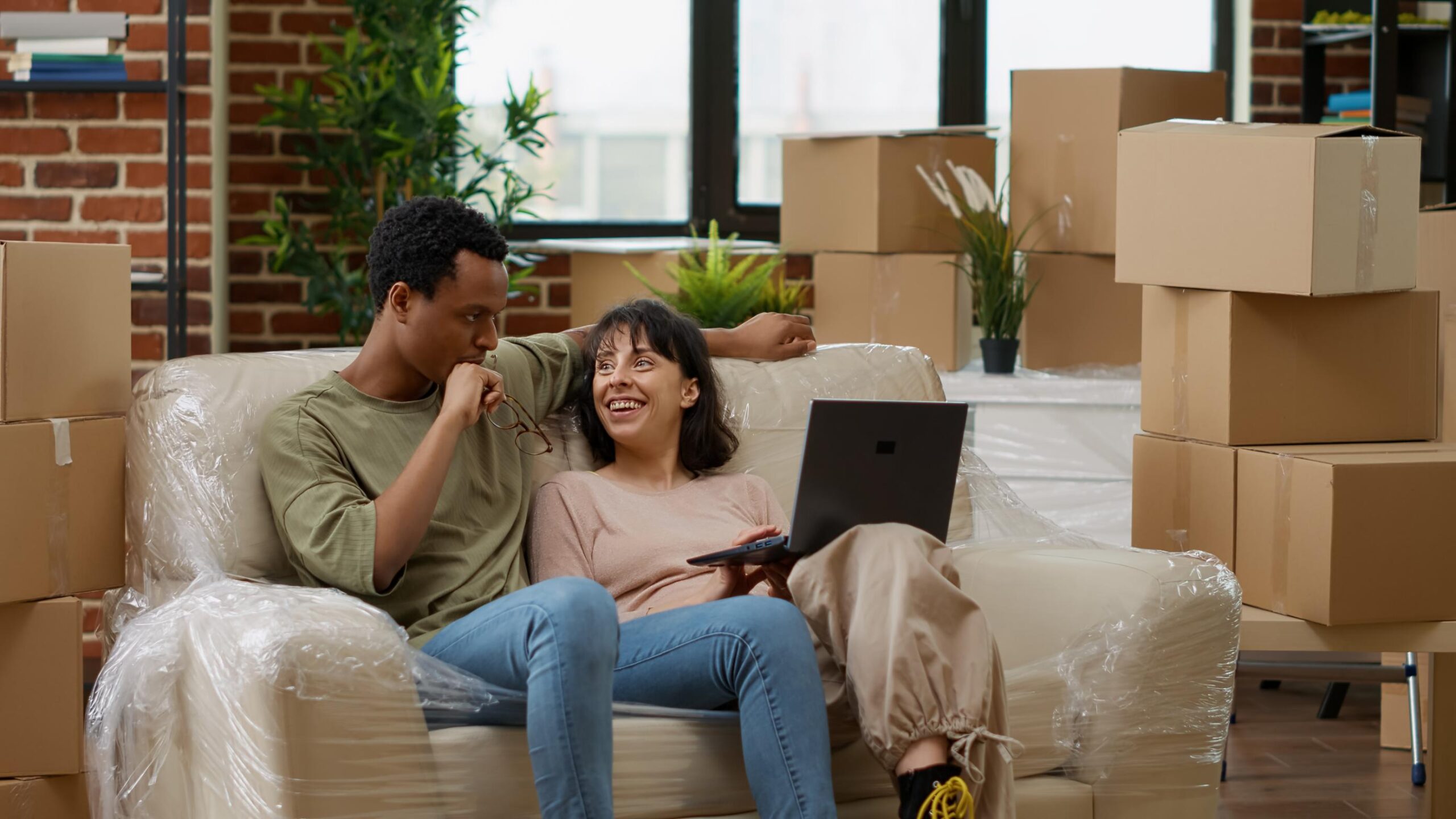 Couple relaxing in their new home after buying a house with a Texas FHA purchase loan